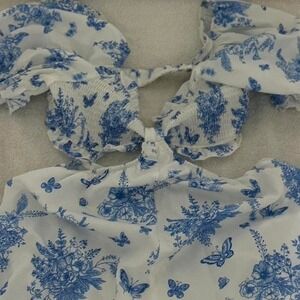 ASOS DESIGN cut out tie front romper in blue floral print